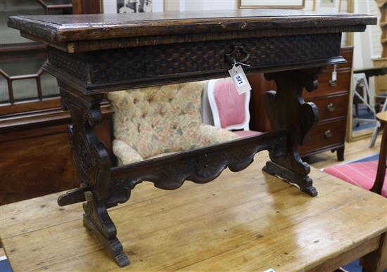 A Continental carved walnut and beech low table, W.99cm